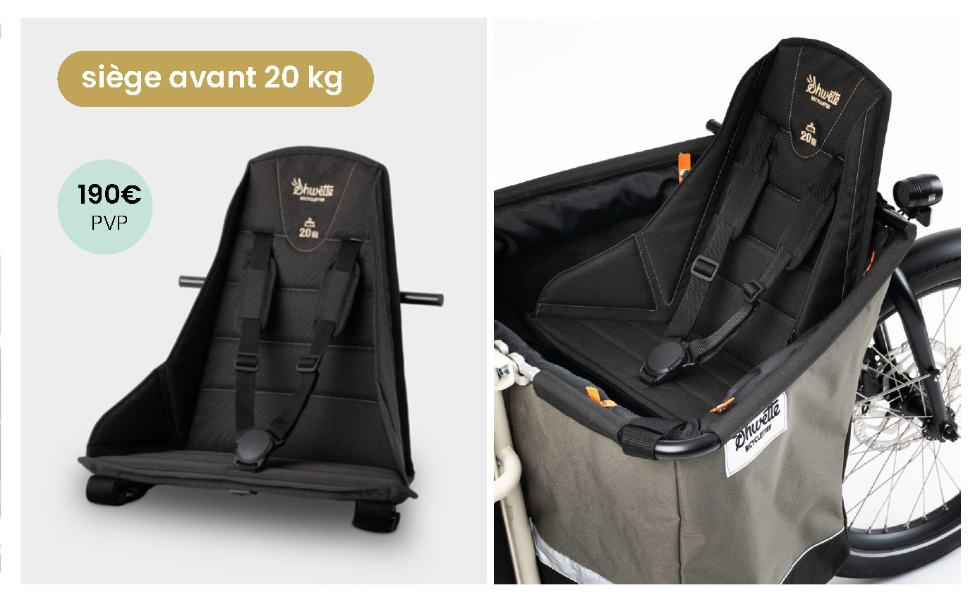 On voit le siège enfant avec ses sangles de sécurité placé dans la caisse de transport avant du vélo Shwette Baggy
